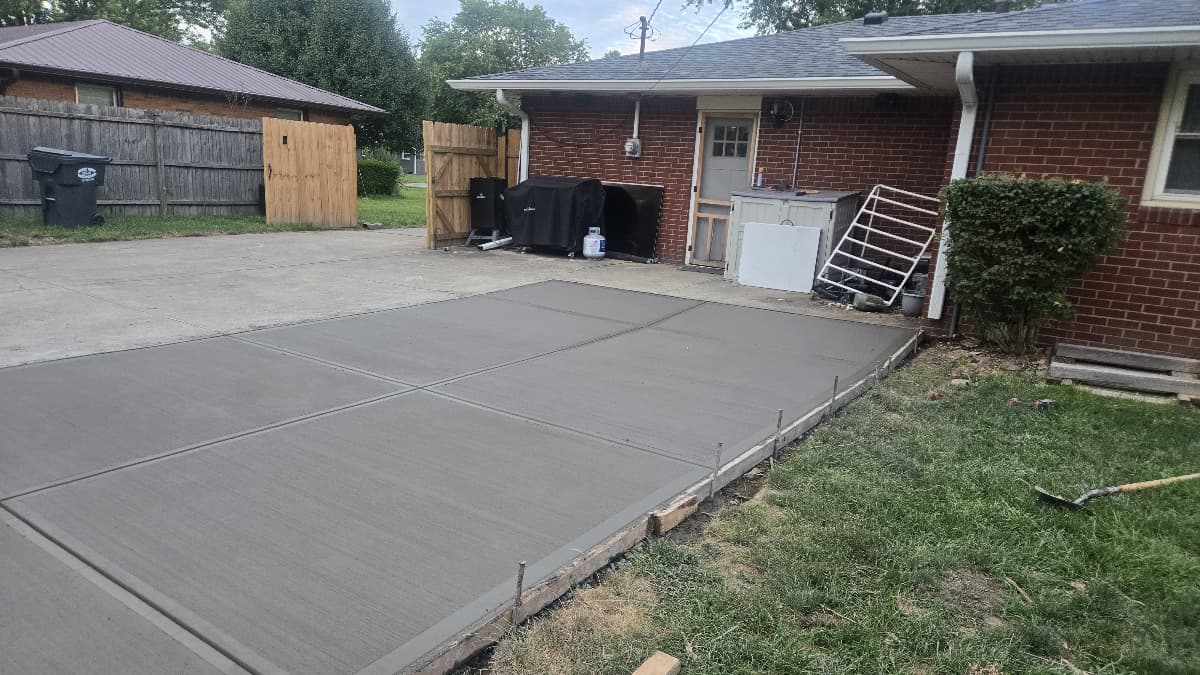 Freshly finished concrete driveway widening at an Anderson, IN home
